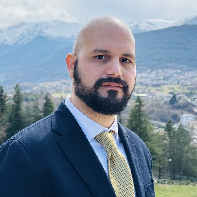 Portrait of Mario Alfonso Prado Romero with the Gran Sasso mountains behind him